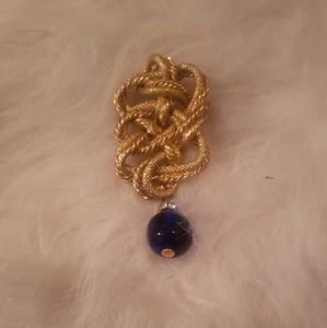 Gold Tone Brooch with a Dangling Black Ball